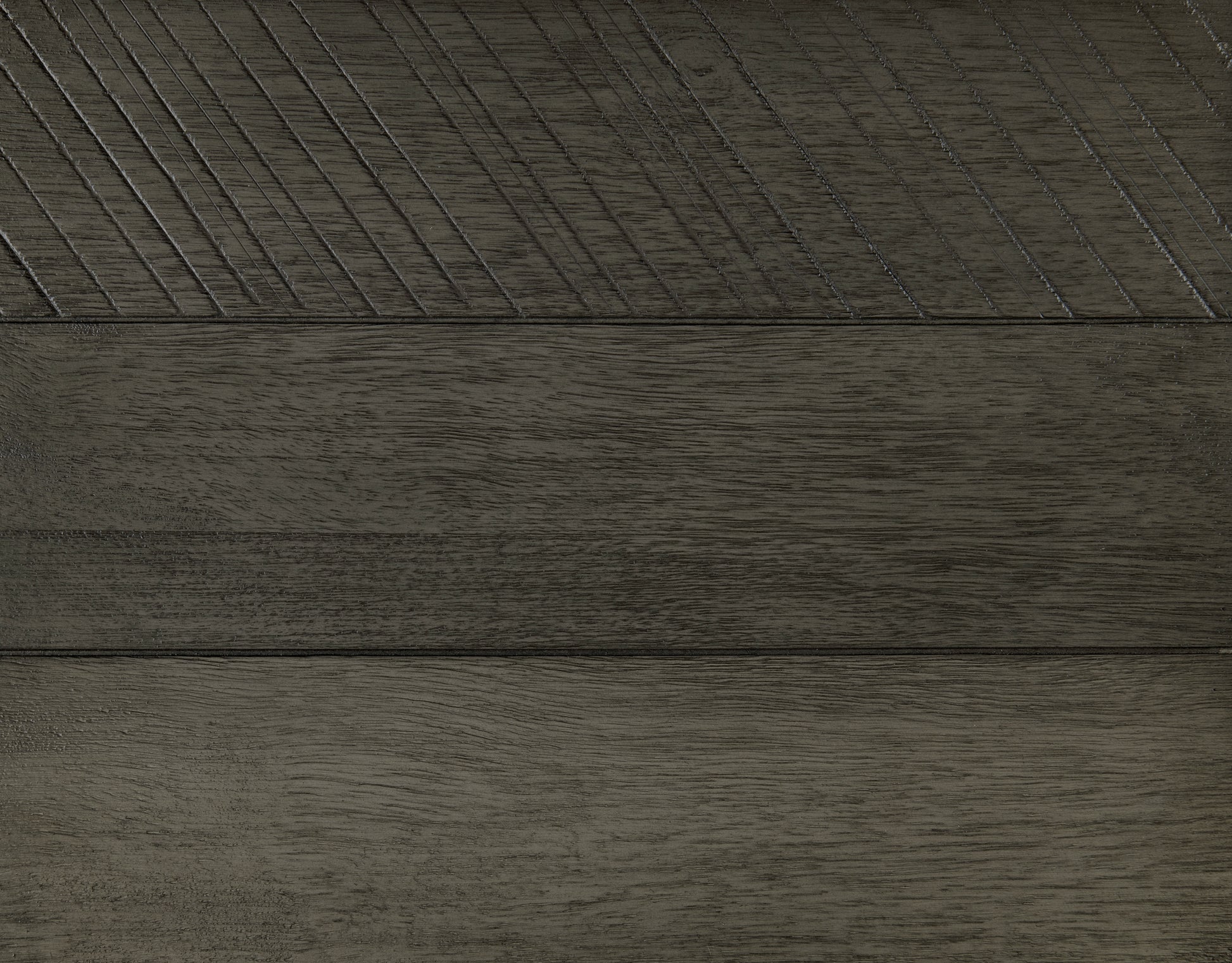 Dark grey wood paneling with diagonal carved lines for texture
