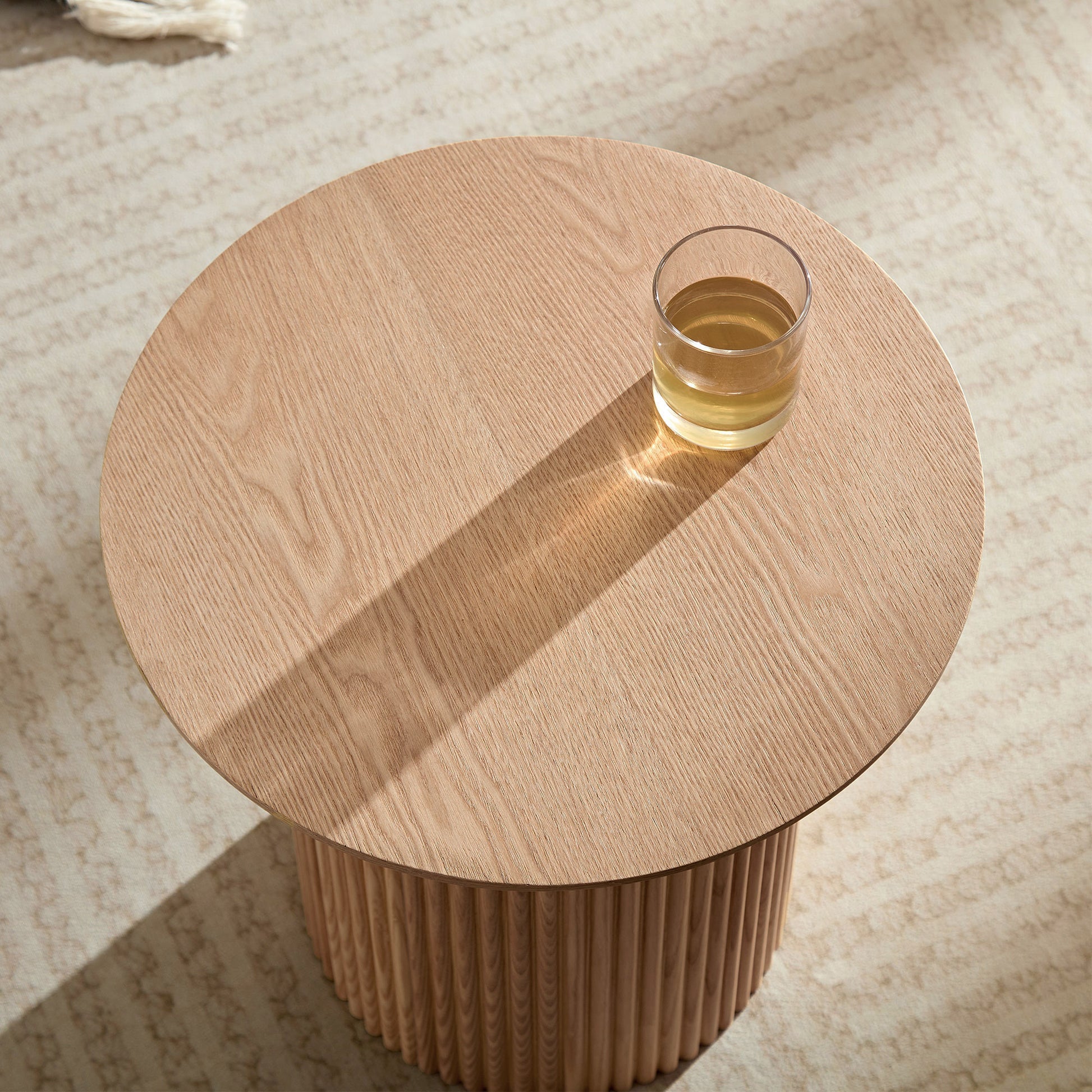 Round oak wood coffee table with fluted base