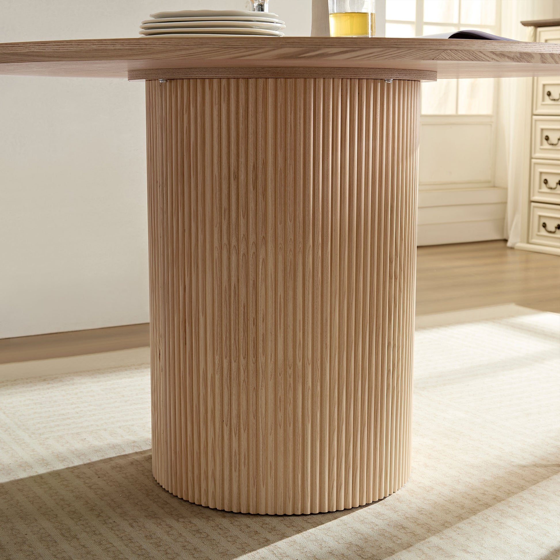 Fluted pedestal base dining table in light oak finish