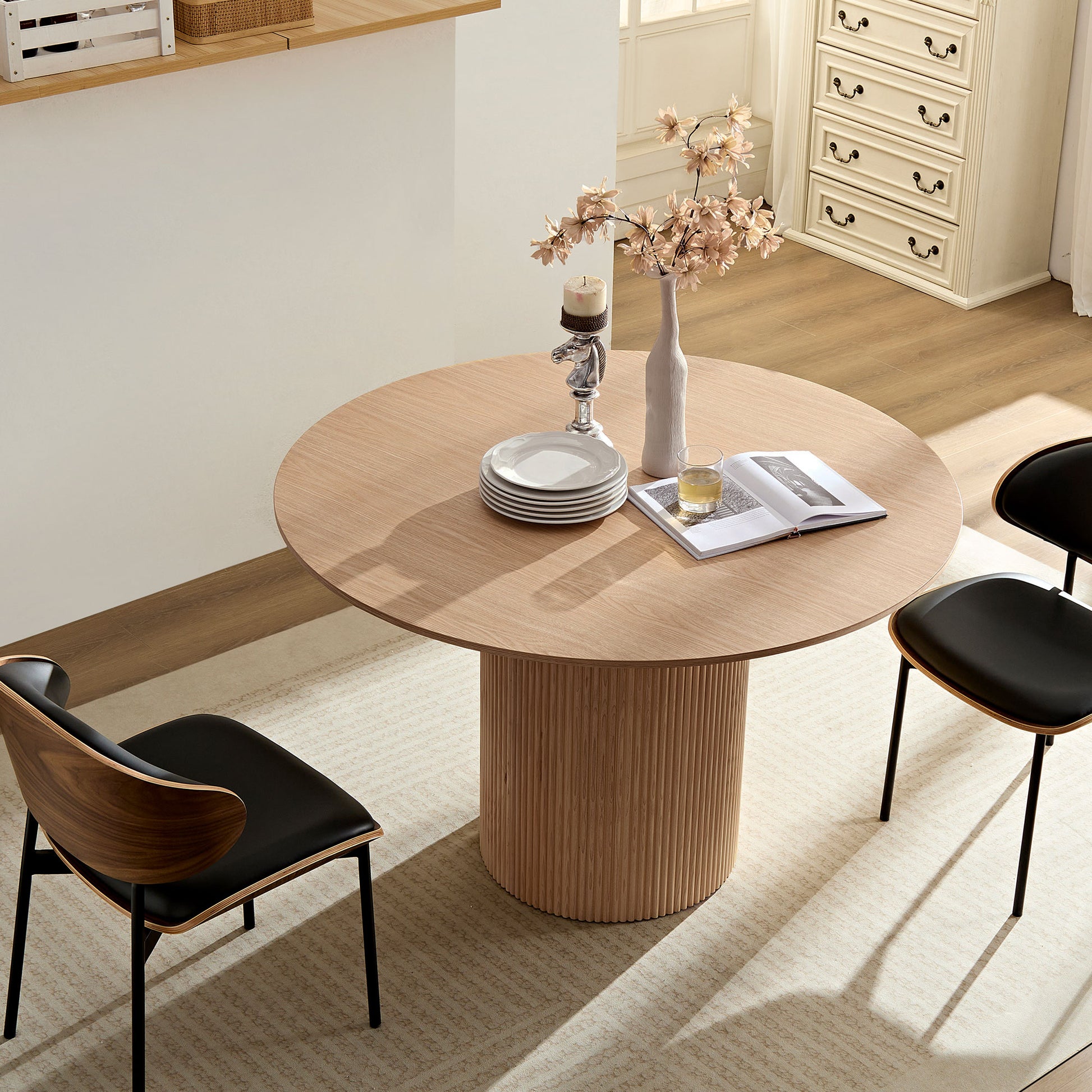 Round oak dining table with fluted base