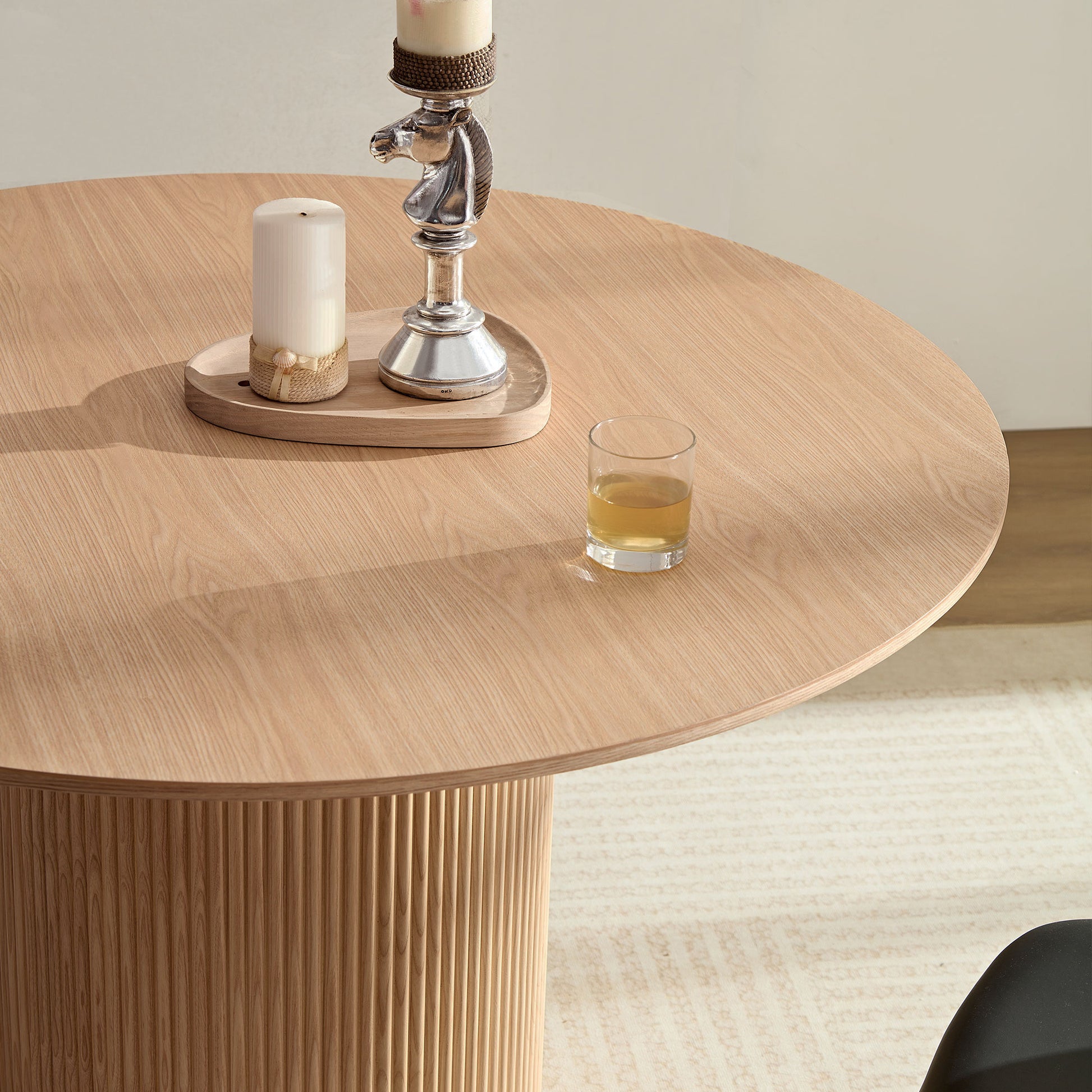 Light oak round dining table with fluted pedestal base
