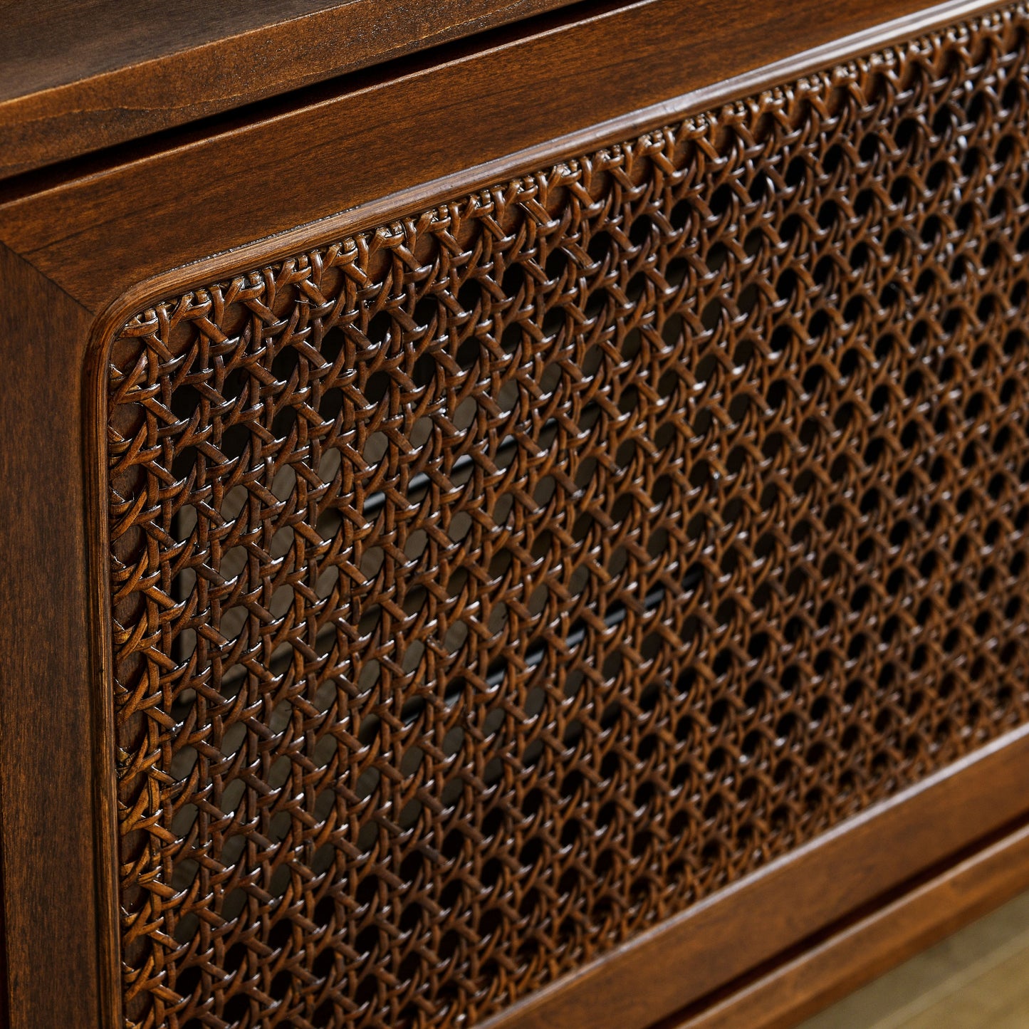Dark wood cabinet with woven cane front panel