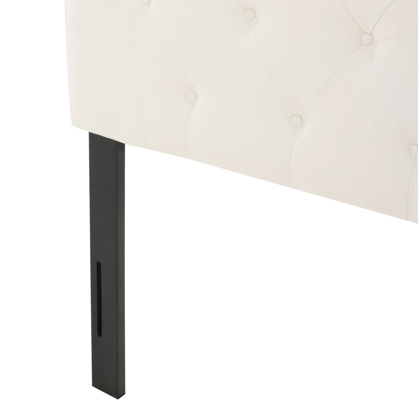 Cream upholstered tufted headboard with dark metal legs