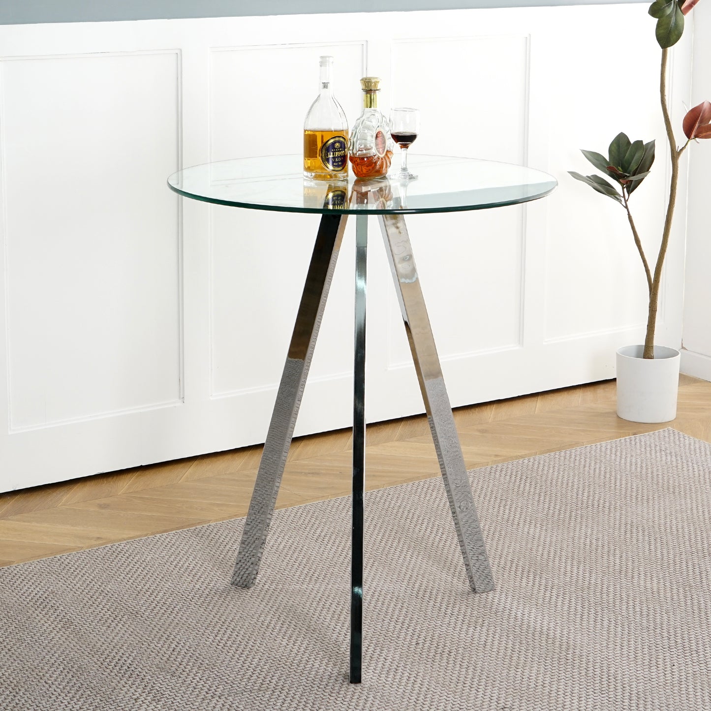 Round glass bistro table with polished chrome tripod base
