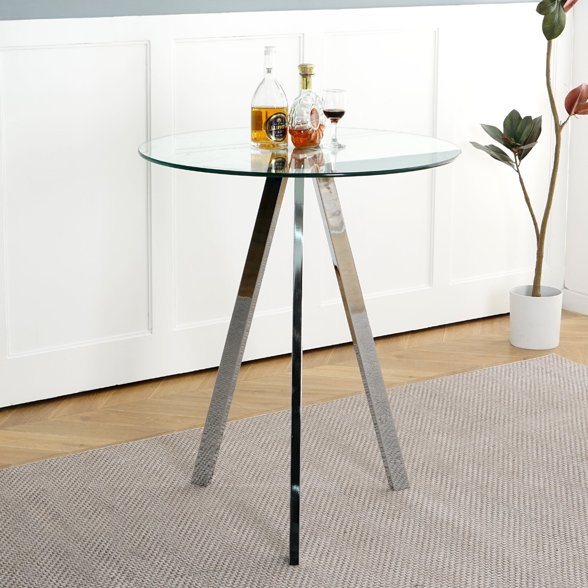 Round glass bistro table with polished chrome tripod base