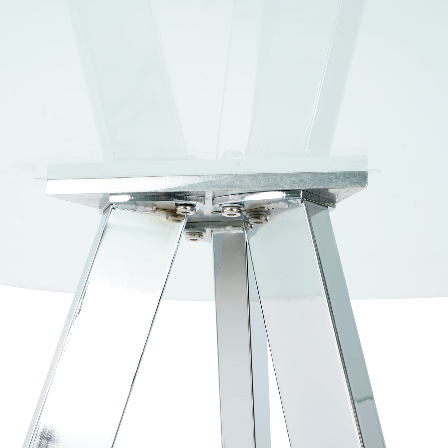 Close up of polished chrome table legs with visible bolts