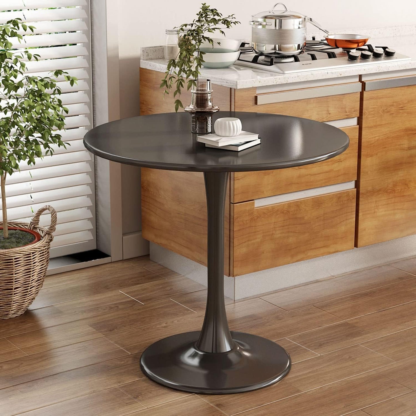 Dark gray round tulip dining table with modern pedestal base