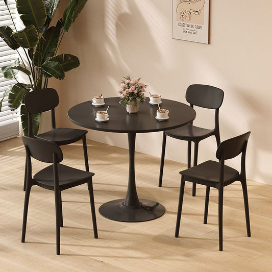 Black tulip base dining table with four matching chairs