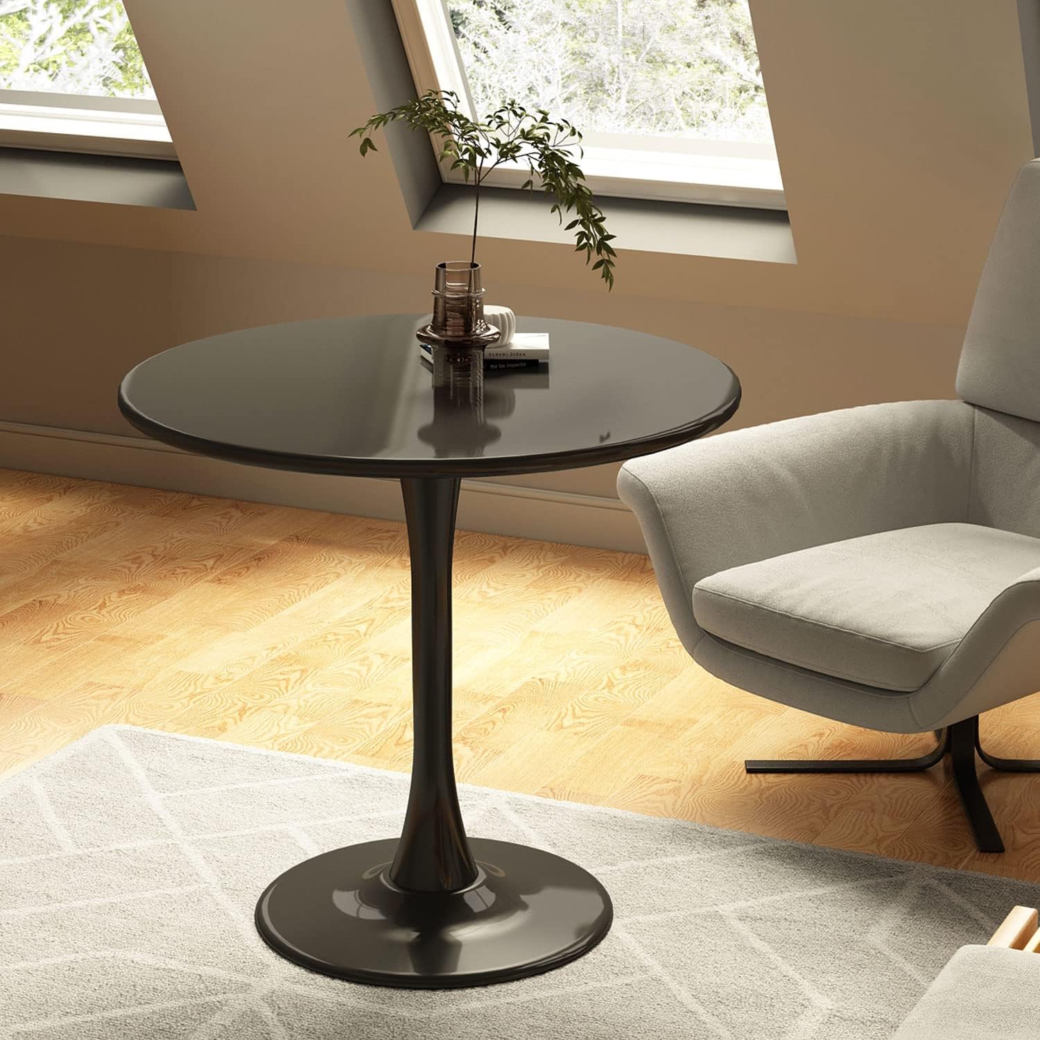 Round black pedestal dining table with glossy finish and modern design