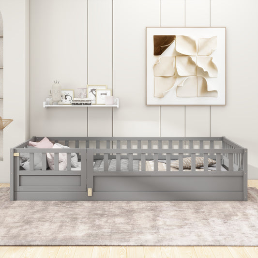 Gray wooden toddler bed frame with safety rails and pillows