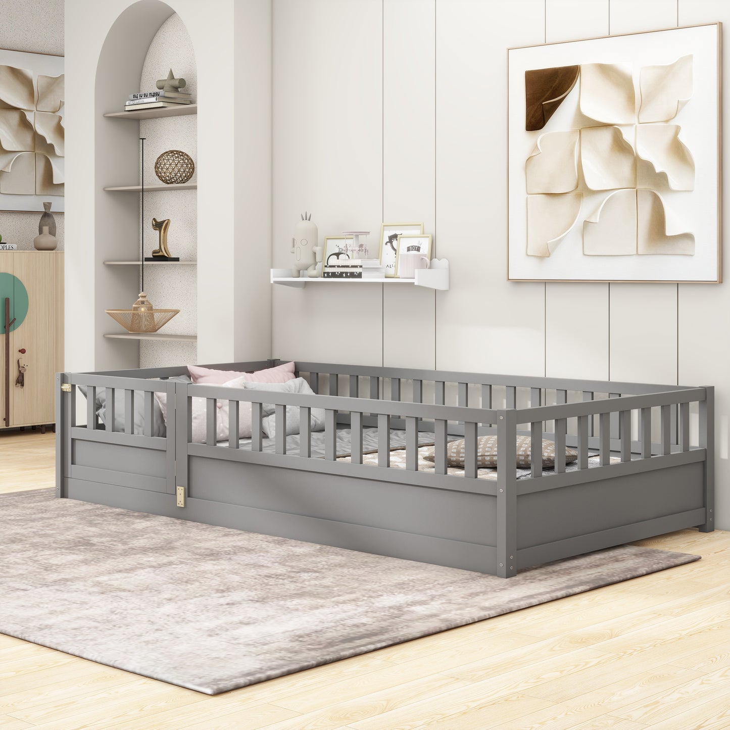 Grey toddler bed frame with safety rails on wooden floor