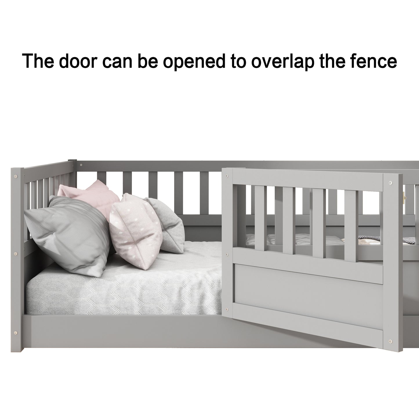 Grey wooden toddler bed with open gate showing soft pillows and a textured blanket