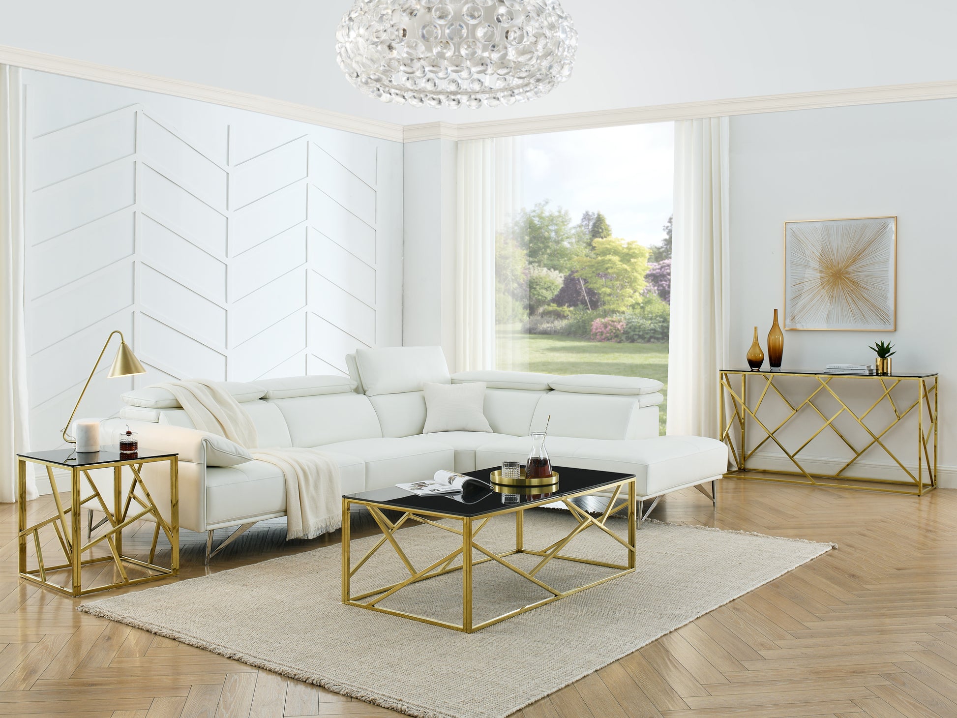 Sleek white leather sectional sofa with modern gold accents and a black glass coffee table