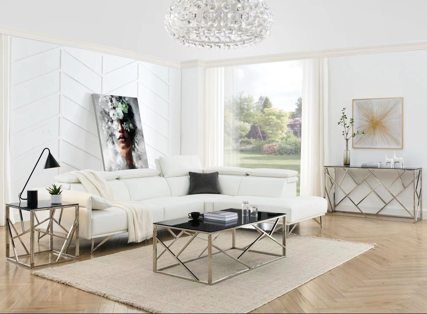 Modern sectional sofa with white leather upholstery and chrome legs