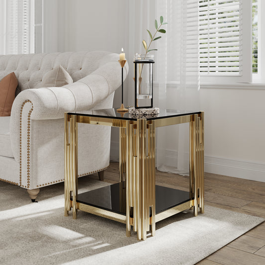 Glamorous gold accent table with a sleek black glass top and contemporary fluted legs