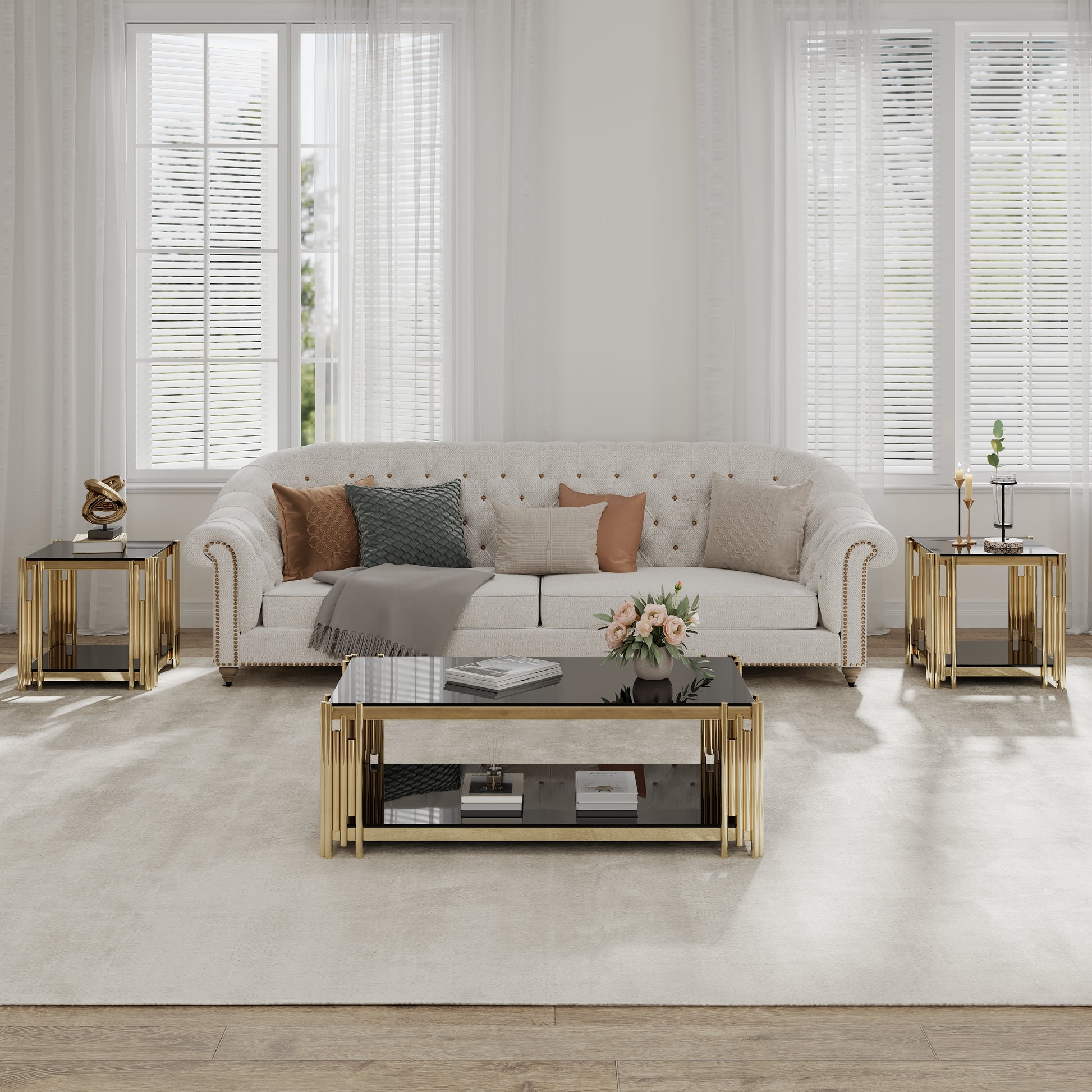 Elegant tufted white sofa with gold accent nailhead trim adorned with plush throw pillows