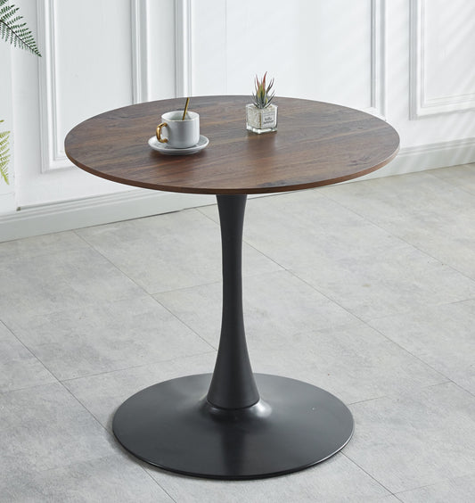 Round walnut dining table with black tulip base perfect for modern kitchens