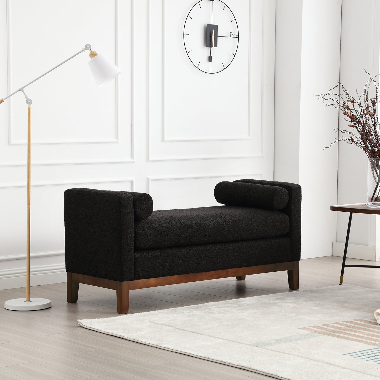 Black boucle bench with wooden legs and bolster arms