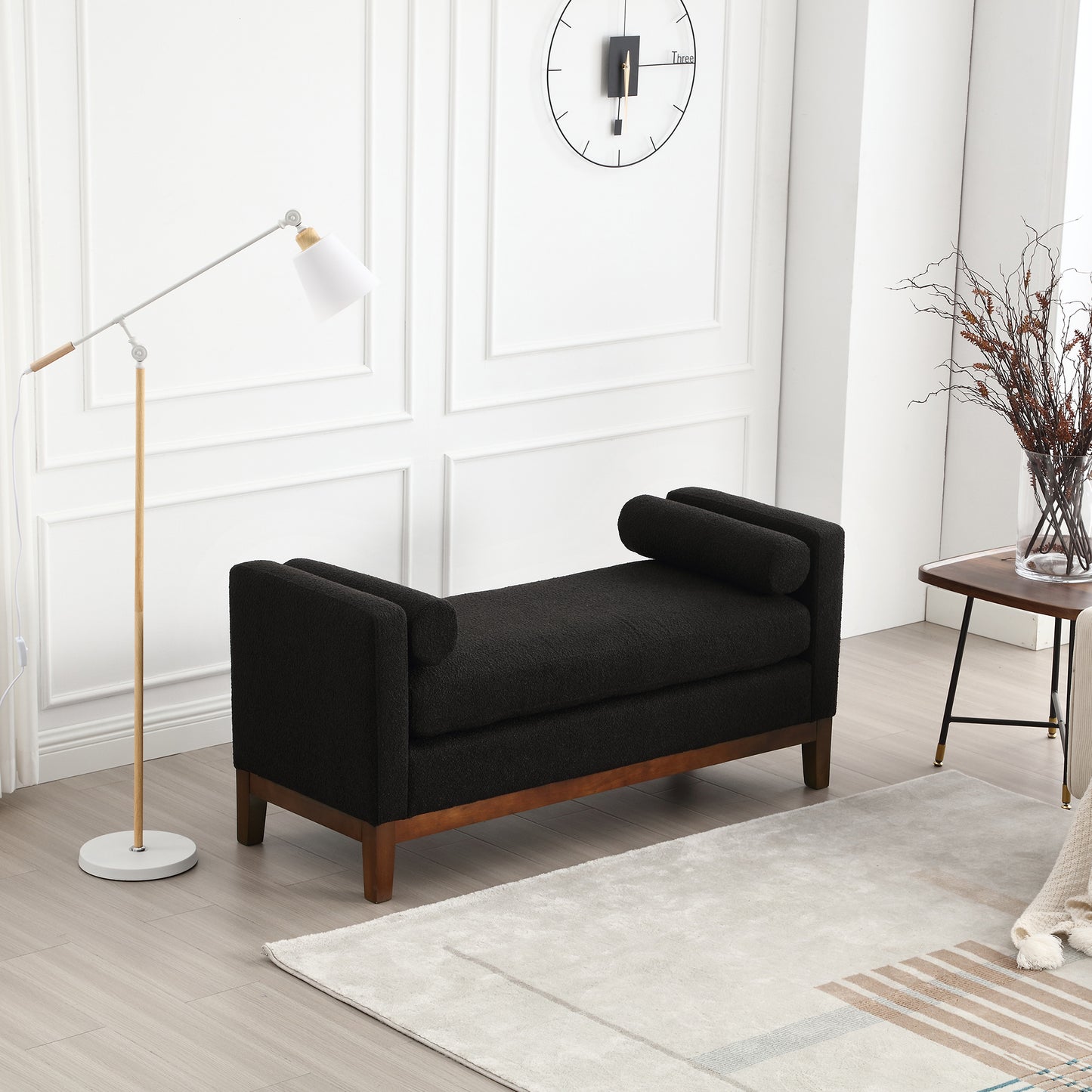 Black boucle fabric bench with rounded arms and wooden legs