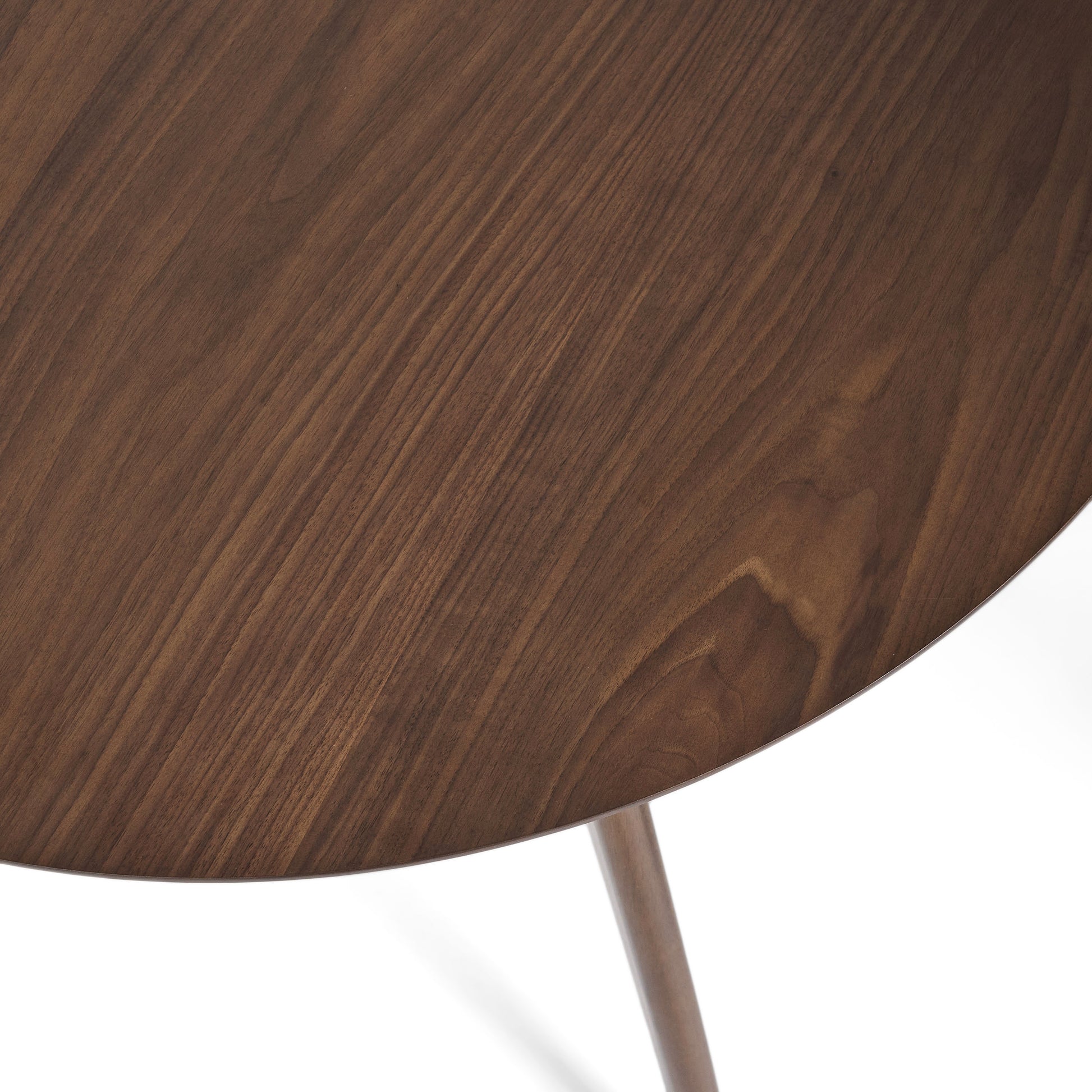 Closeup of polished dark walnut wood grain on a round tabletop