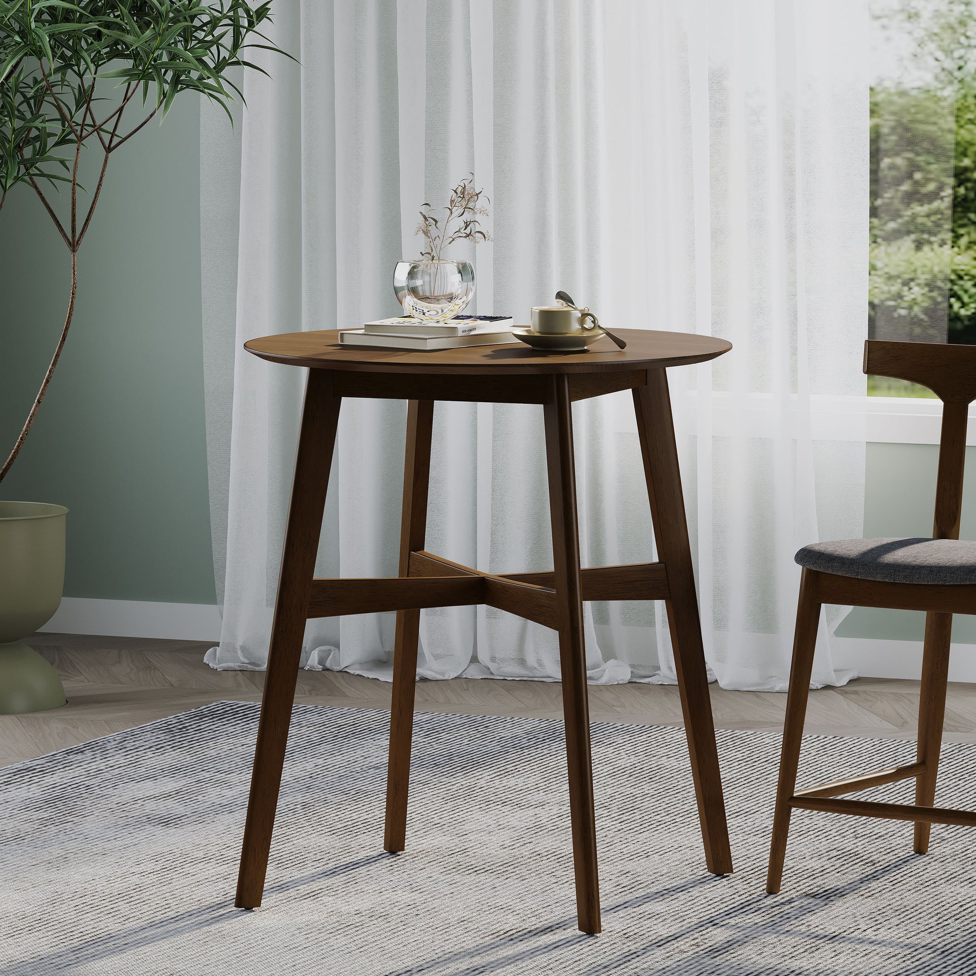 Round dark wood bistro table with a crossbrace base