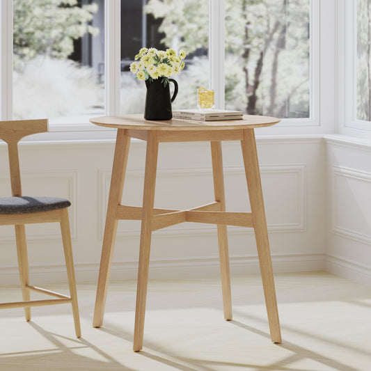 Round oak pub table with grey upholstered stool and yellow flowers