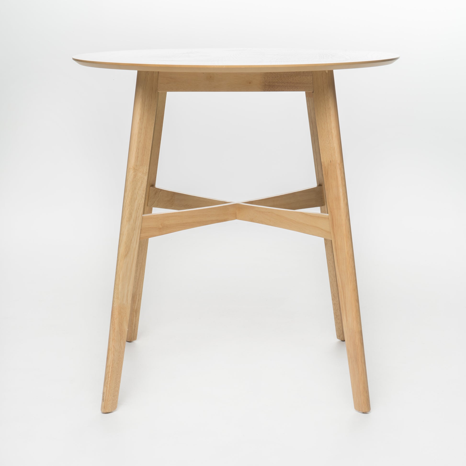Round light wood dining table with tapered legs and cross brace