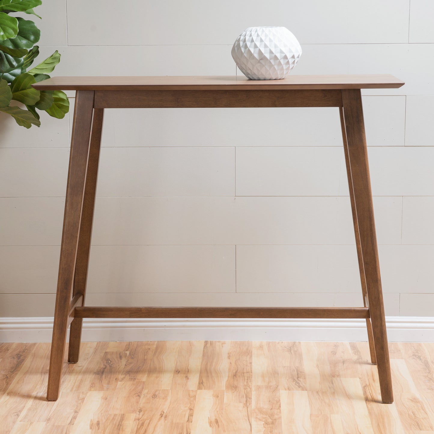 Brown wood hightop console table with white geometric vase