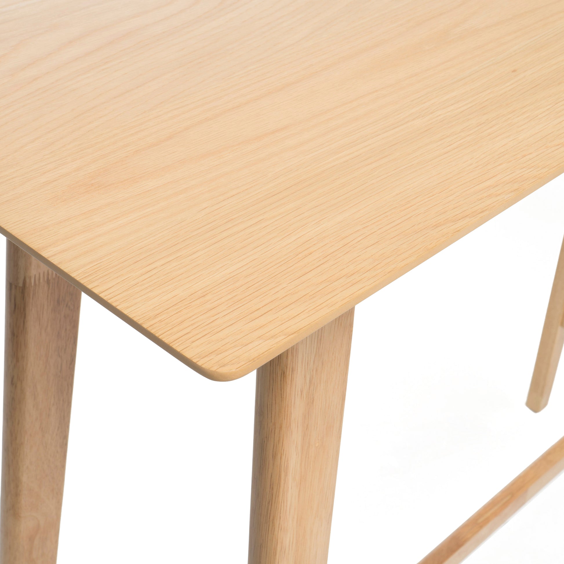 Minimalist light wood dining table with rounded corners