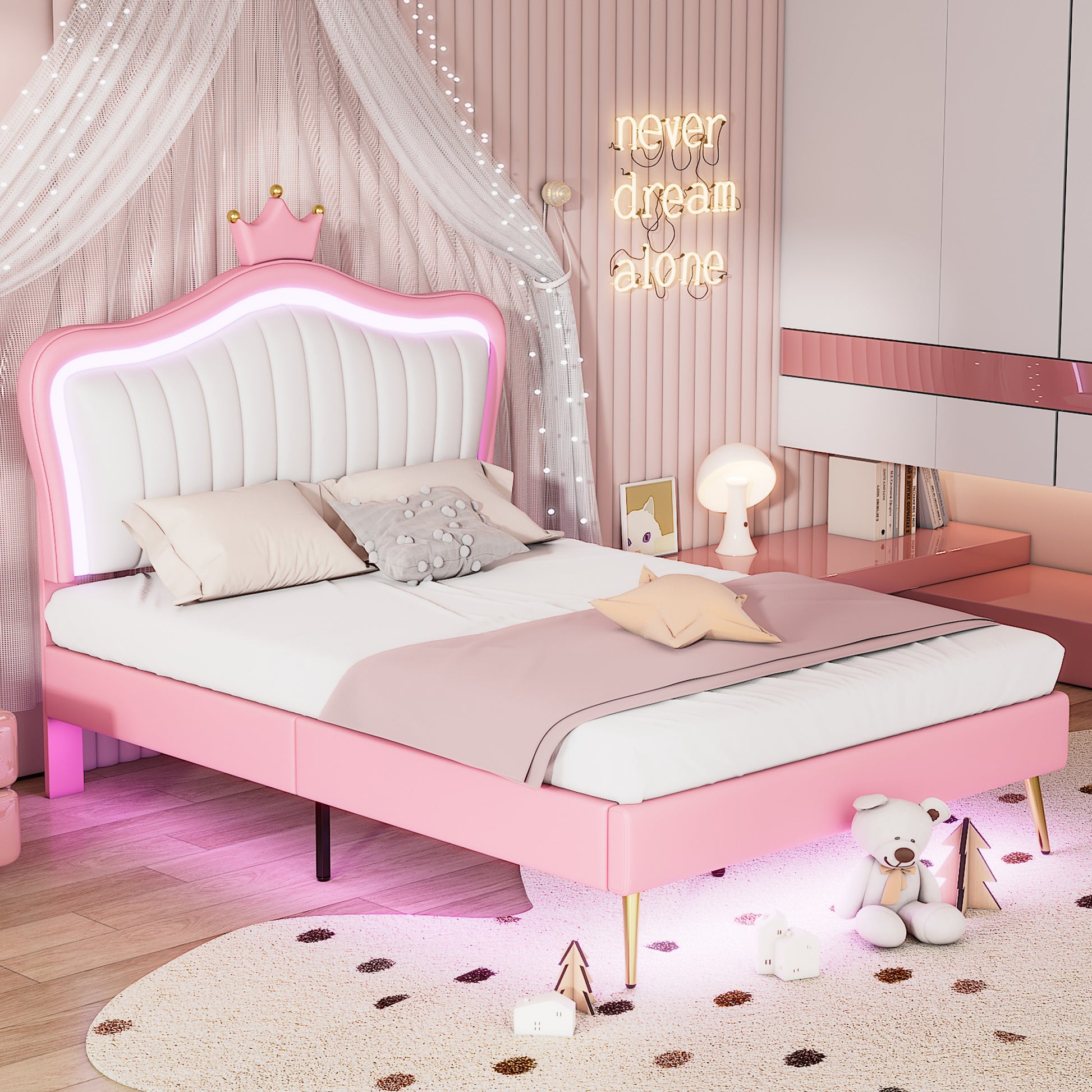 Pink upholstered twin bed with crown headboard and LED lights