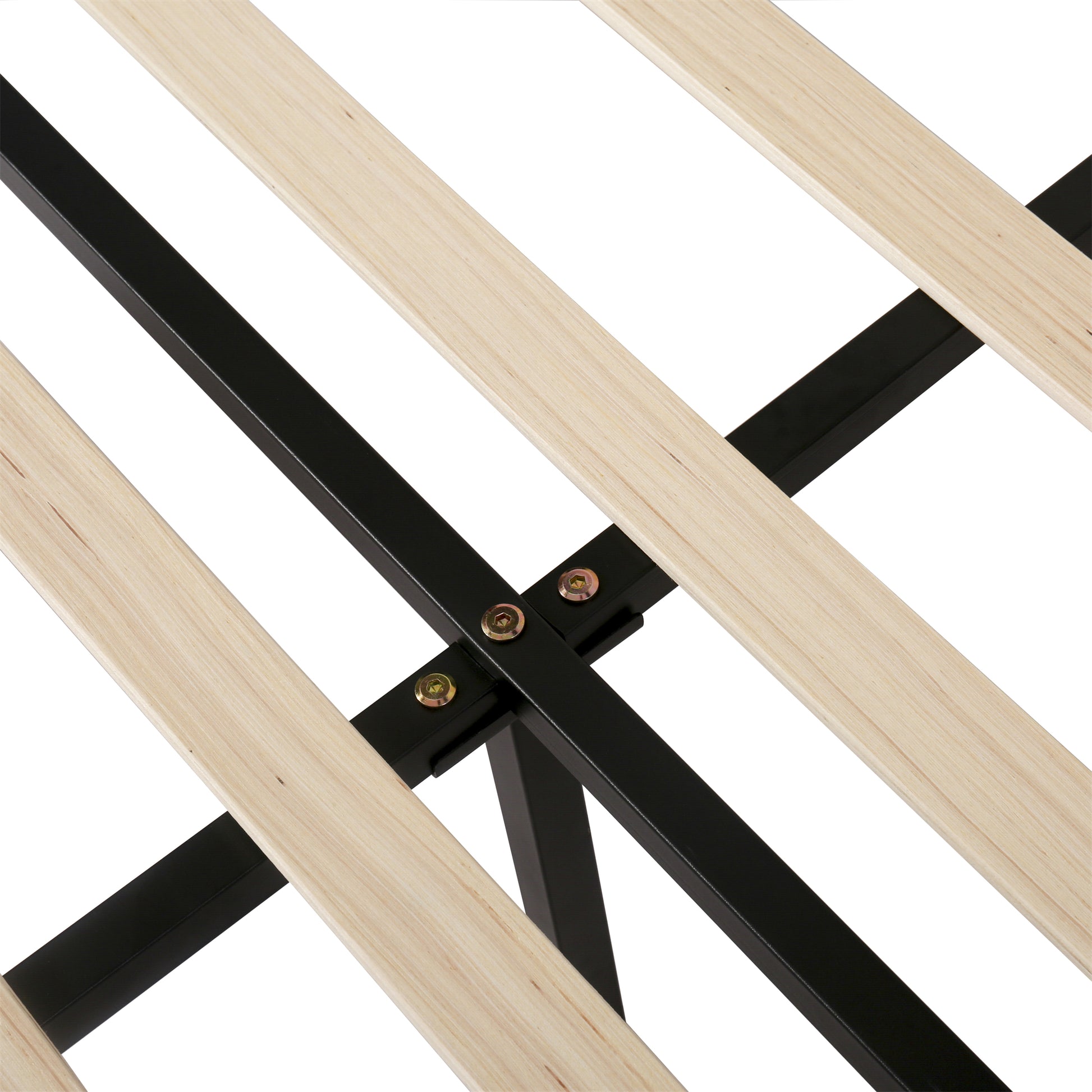 Closeup of a black metal bed frame with natural wood slats