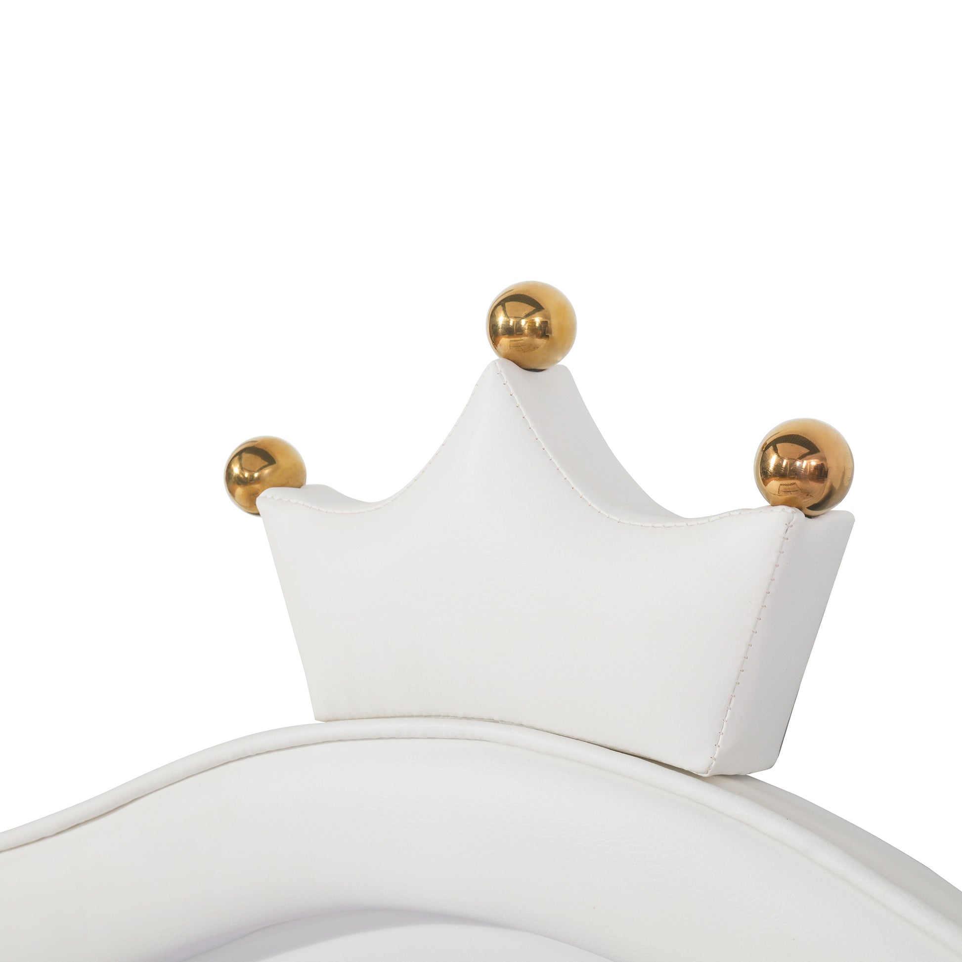 White faux leather crown accent with gold ball details on a decorative curved piece