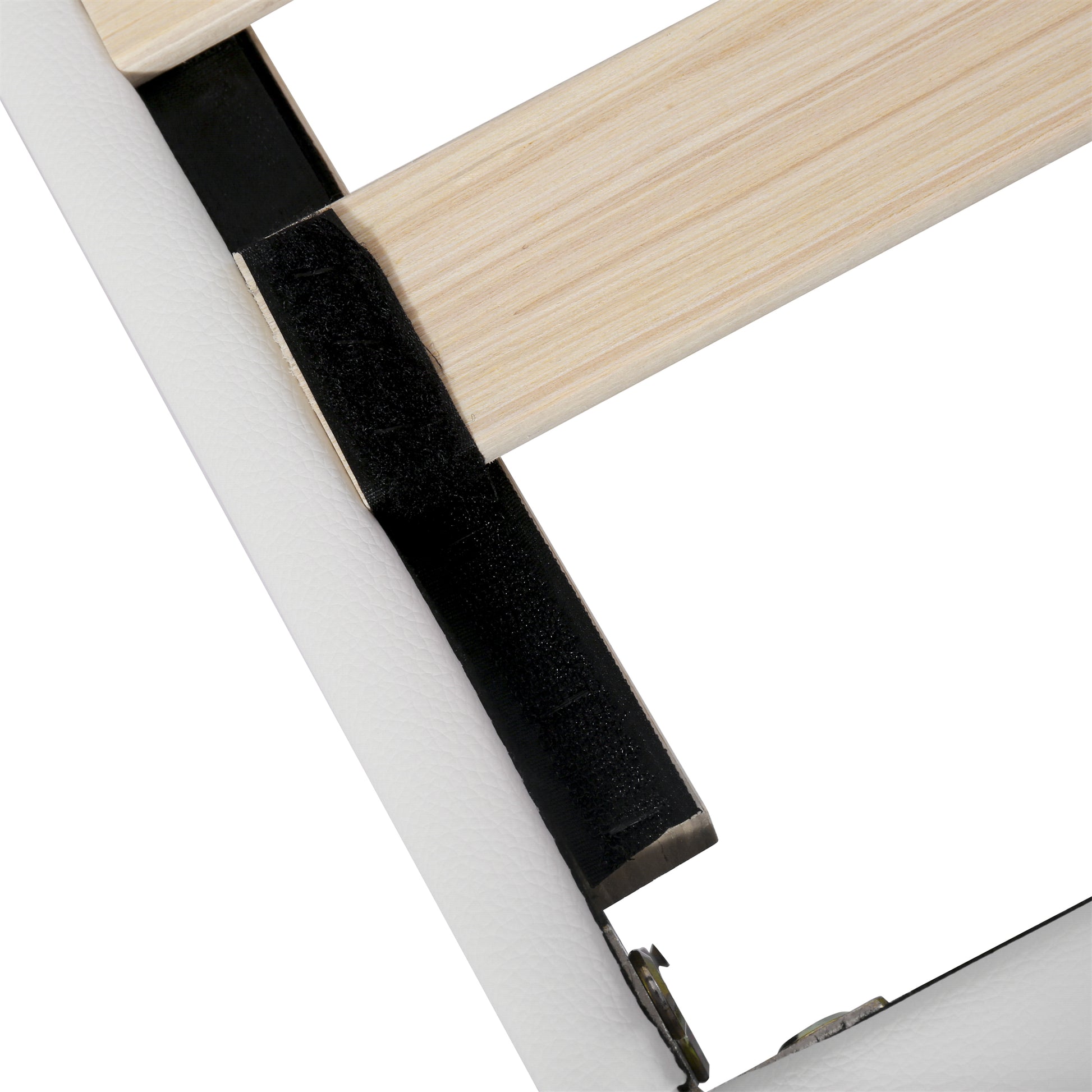 White faux leather bed frame edge with wooden support and black velcro strip