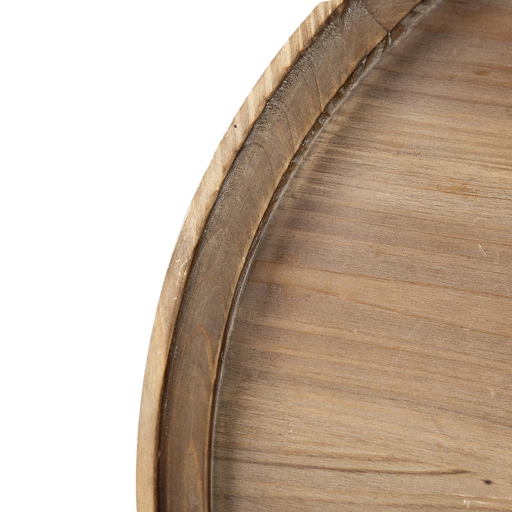 Closeup of natural wood grain texture on a round serving tray