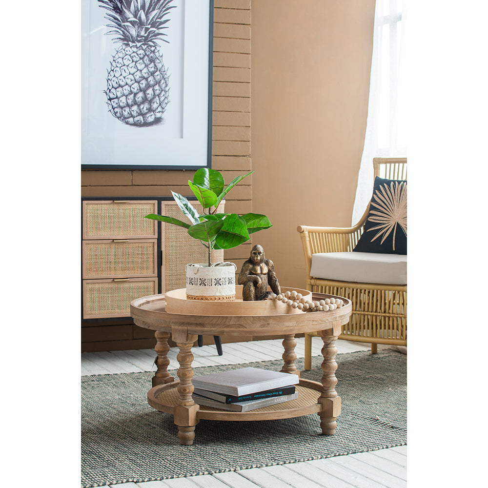 Round distressed wood coffee table with cane shelf