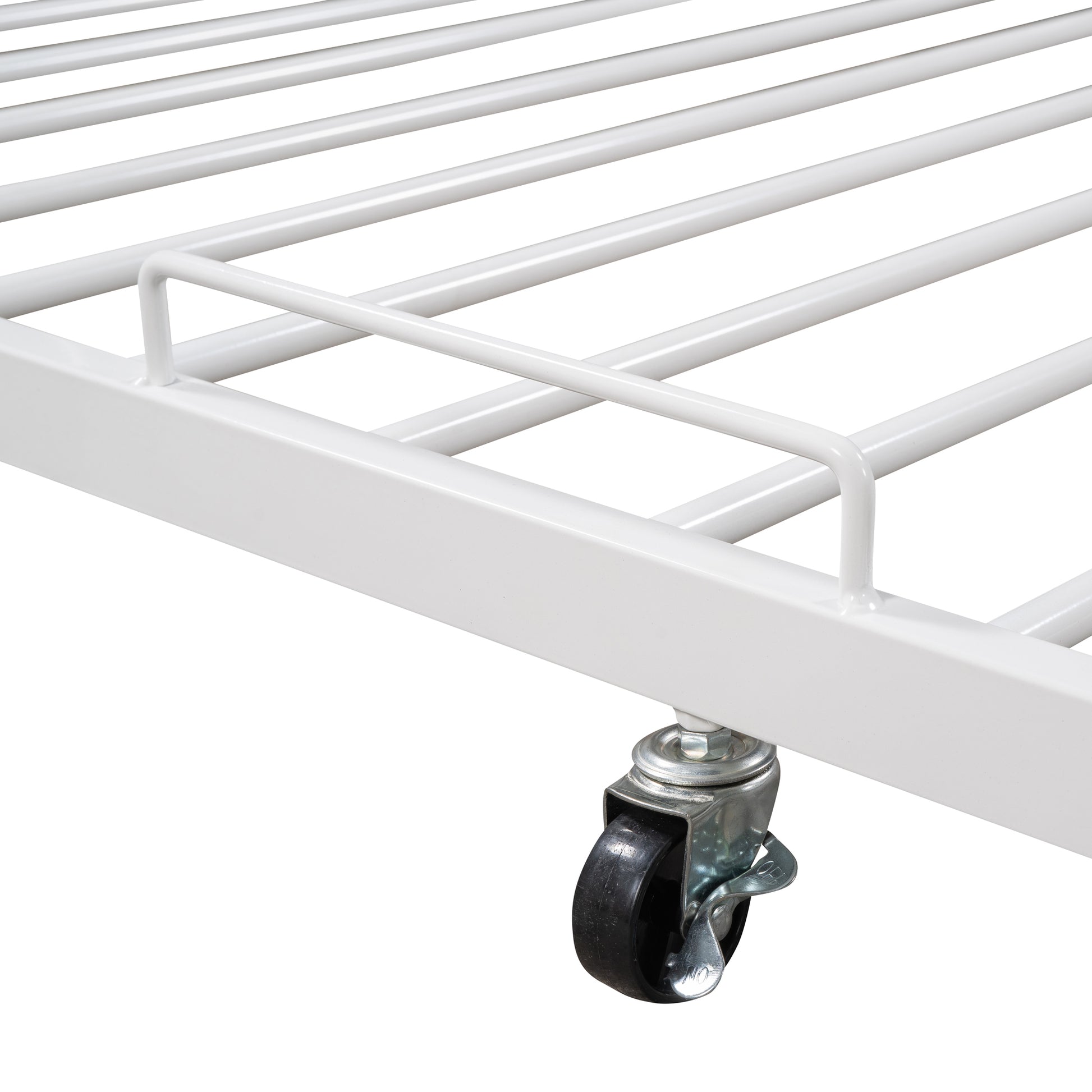 White metal bed frame detail with rolling caster wheel