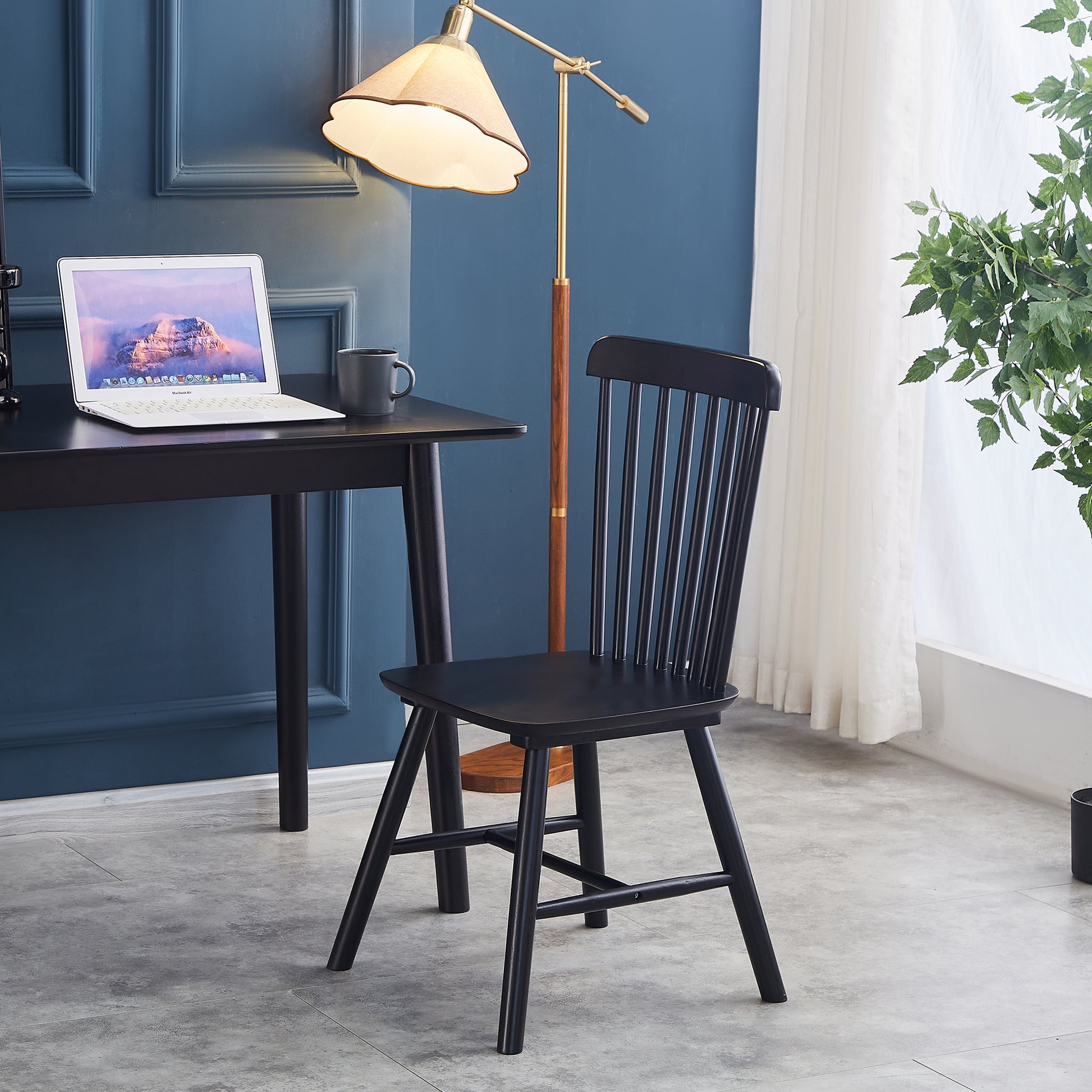 Black wooden dining chair with spindle back