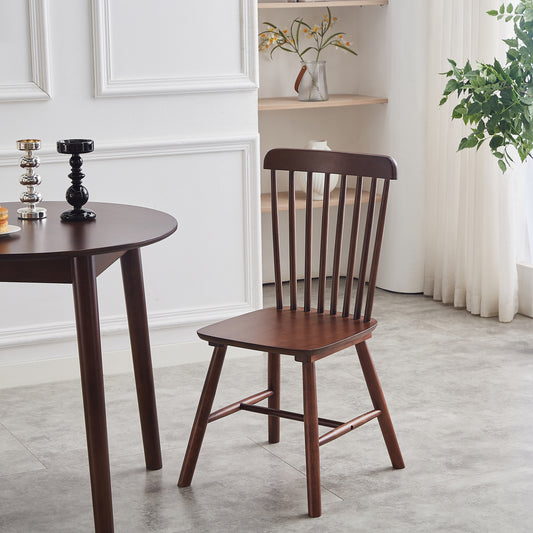 Solid wood dining chair with spindle back and rich mahogany finish perfect for modern kitchens