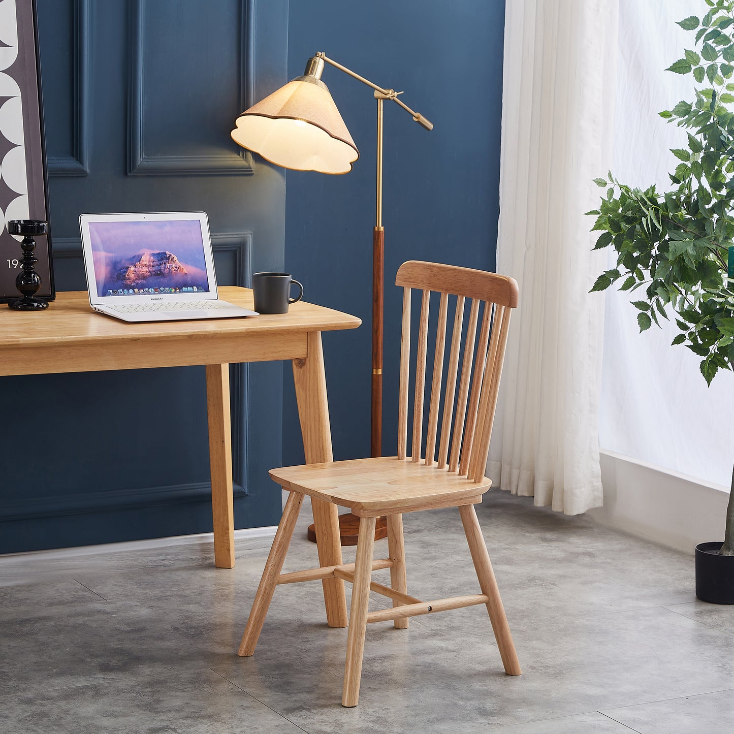 Light wood dining chair with spindle back and a natural finish