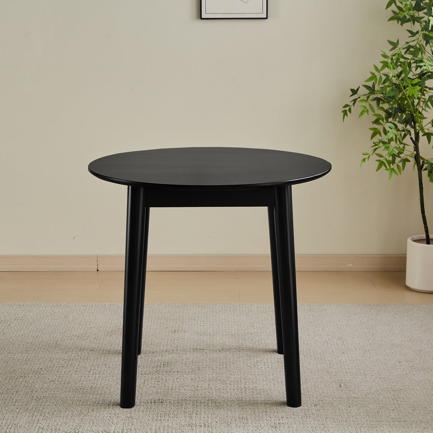 Black round dining table with modern minimalist design
