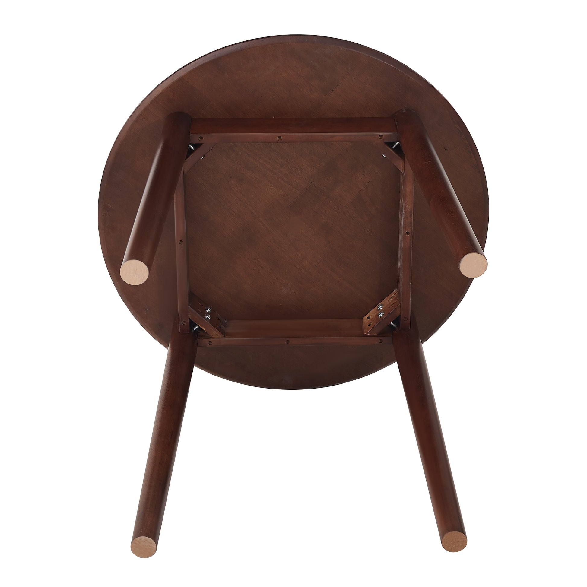 Underside view of a dark wood round coffee table with tapered legs