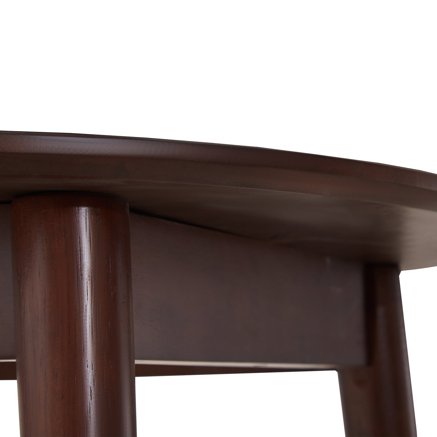 Closeup view of dark brown wooden round table edge and cylindrical legs