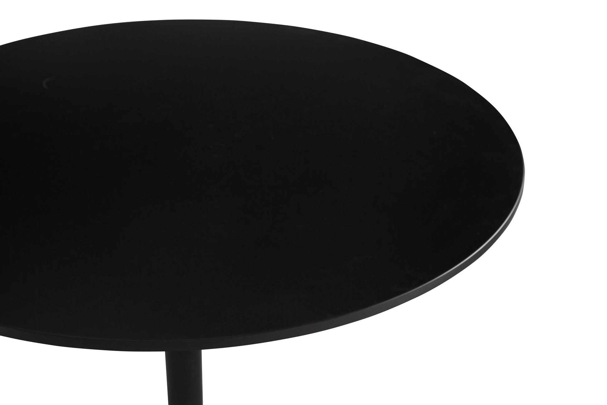 Black round coffee table top with a matte finish and sleek metal leg