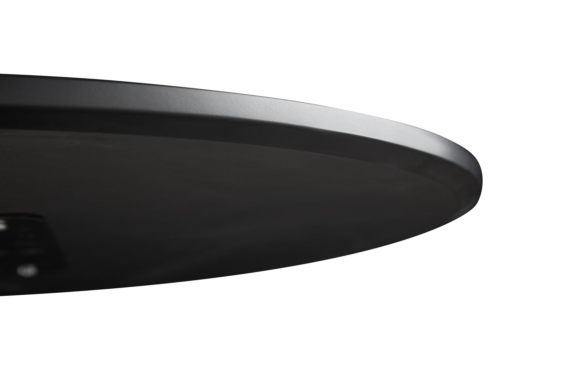 Closeup of a sleek black metal tabletop edge
