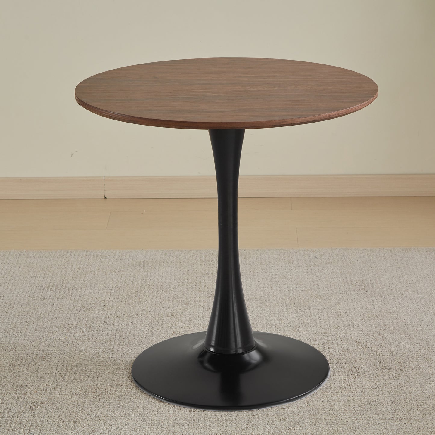 Round walnut veneer side table with black pedestal base
