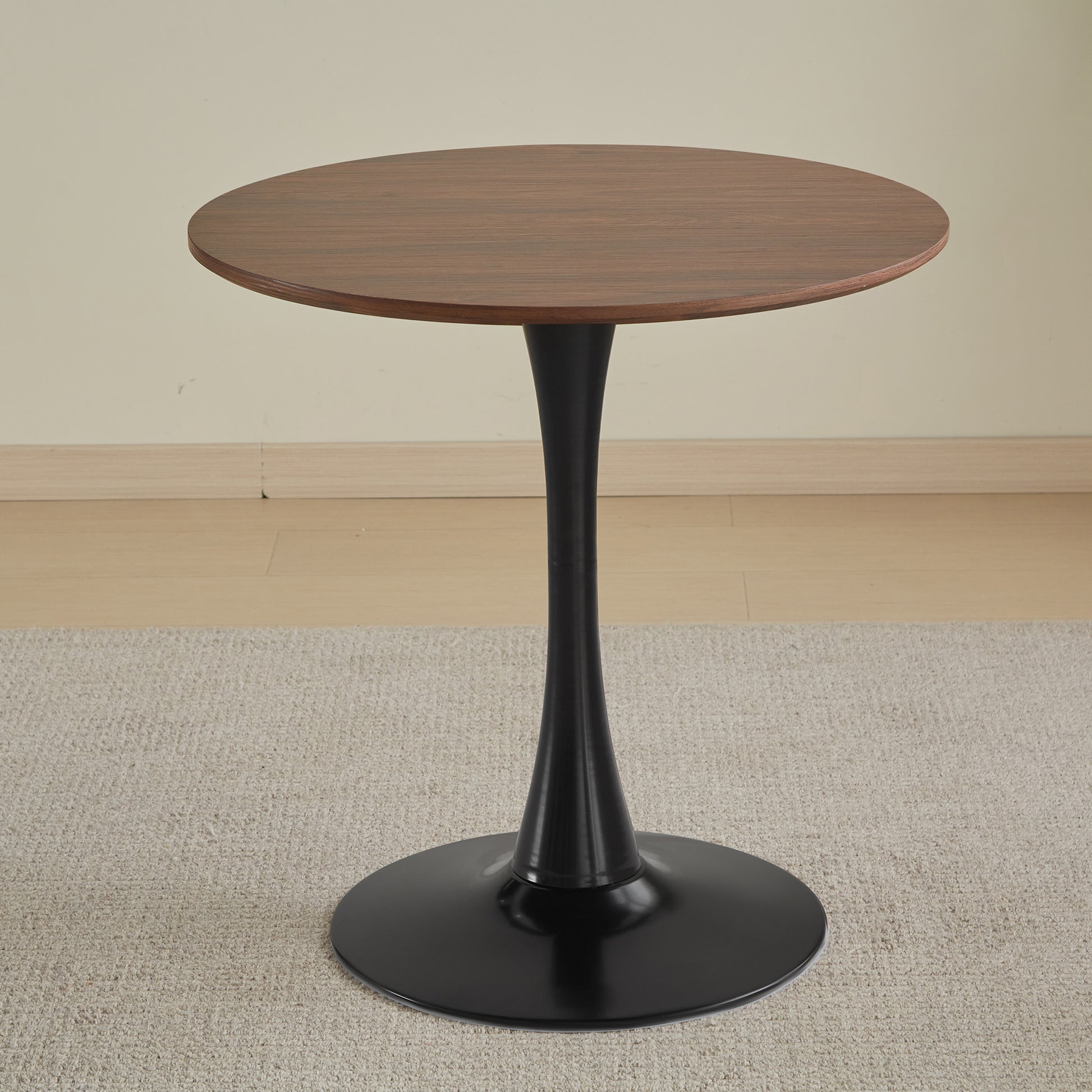 Round walnut veneer side table with black pedestal base