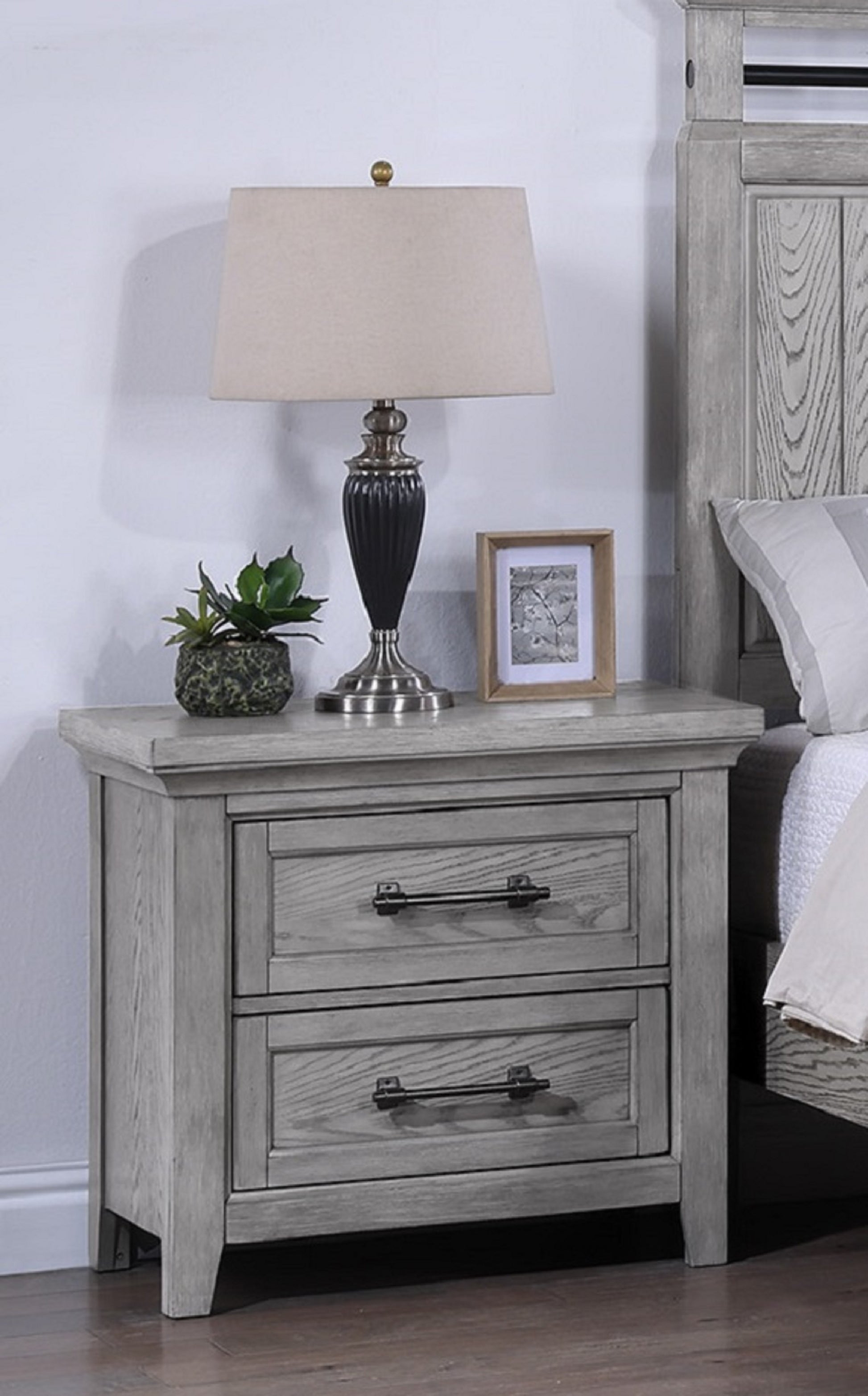 Gray wooden nightstand with two drawers and dark metal handles