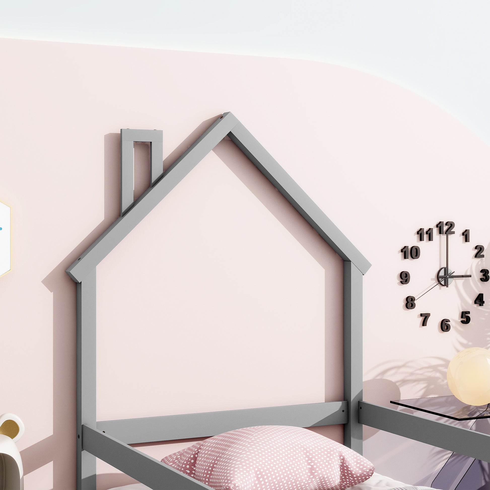 Gray wooden house bed frame with pink polka dot pillow