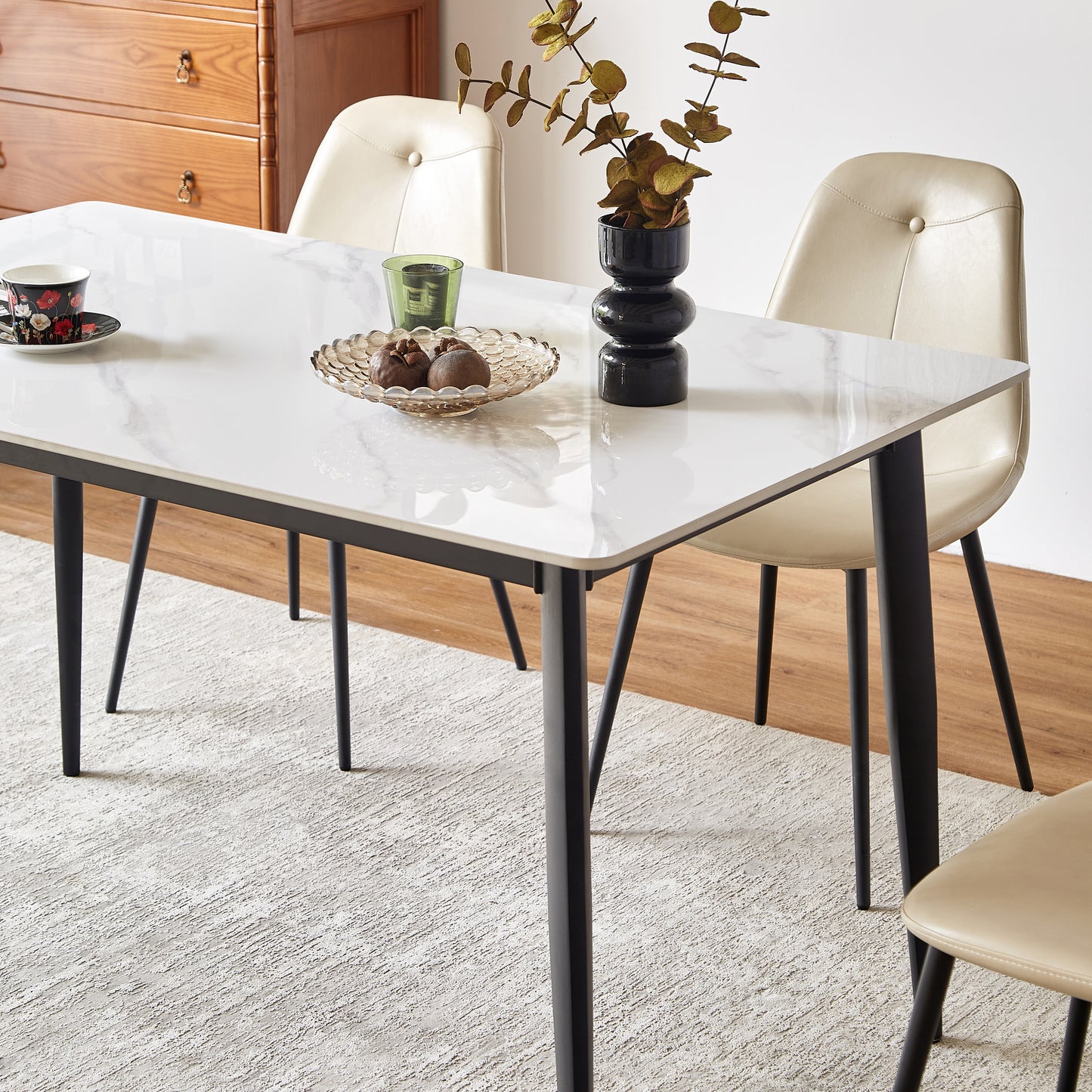 White marble dining table with black legs