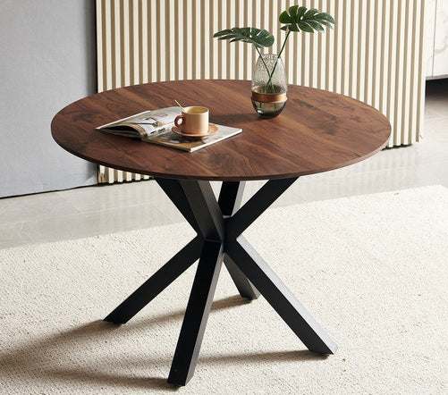 Round walnut dining table with black metal base